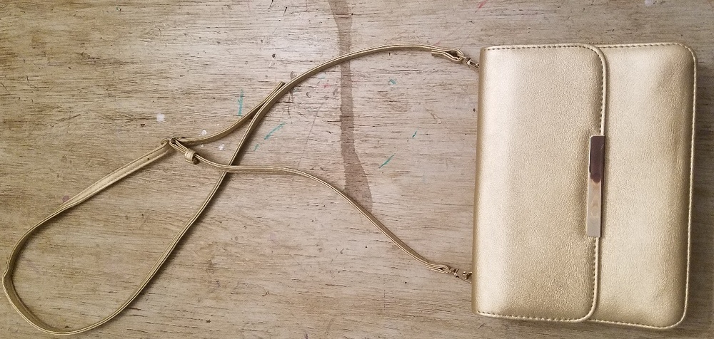 Gold sling purse